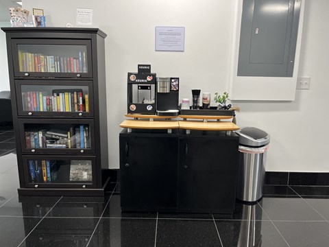 a coffee kiosk in the lobby of a library