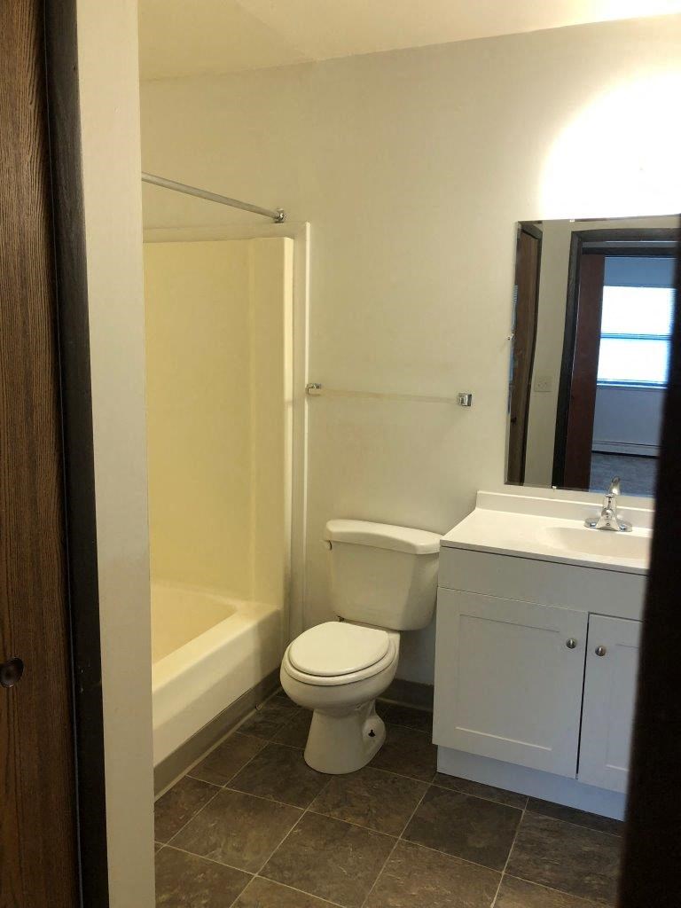 a bathroom with a toilet sink and bathtub