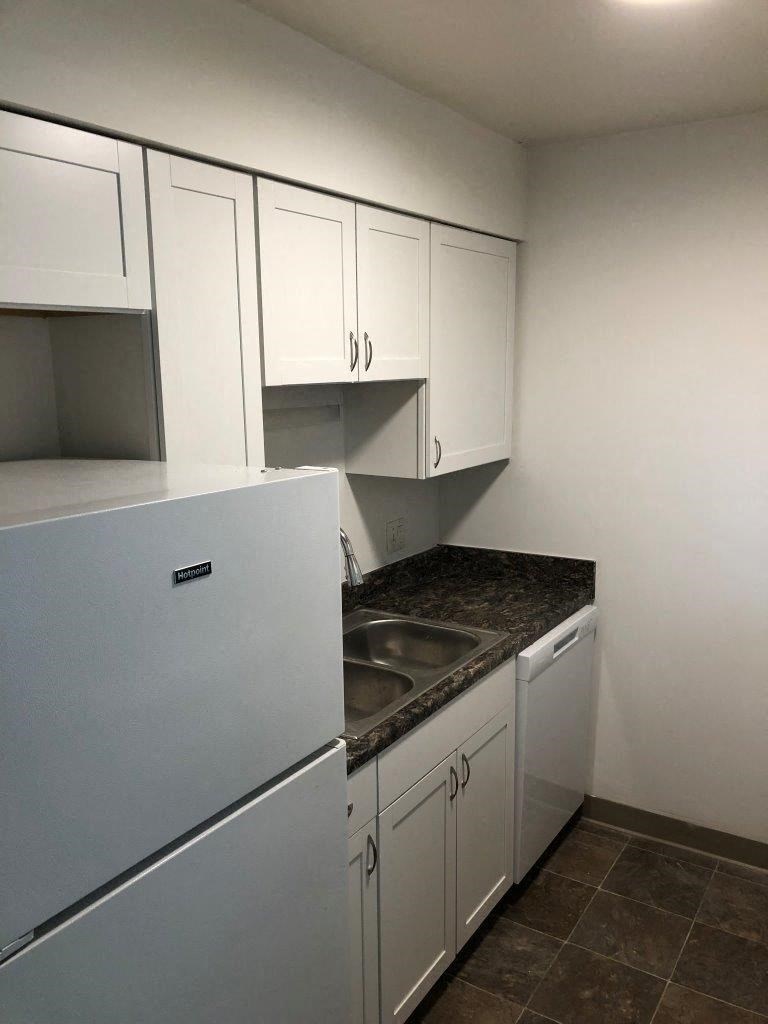 a kitchen with a sink and a dishwasher