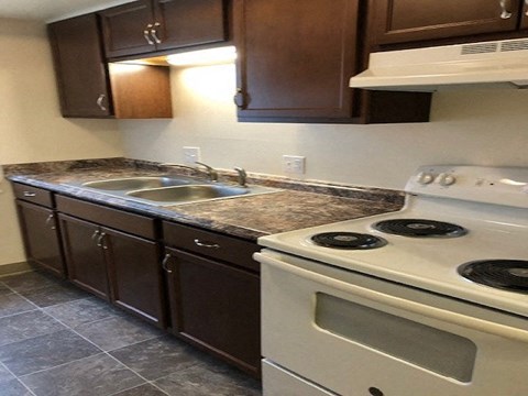 a kitchen with a stove and a sink