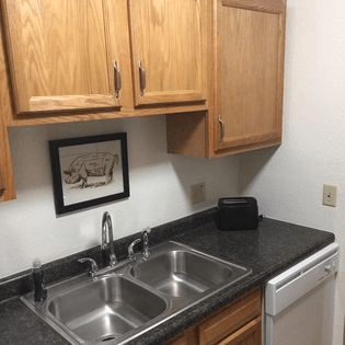 a kitchen with a sink and a dishwasher