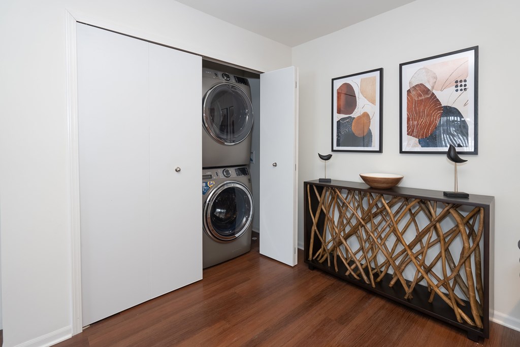 A laundry room with a washer and dryer in it.