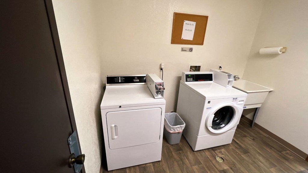 a small laundry room with a washing machine and a dryer