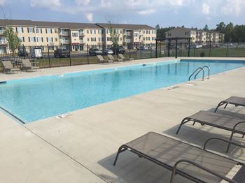 Swimming Pool with Lounge Chairs at Walker Estates Apartments, 30906