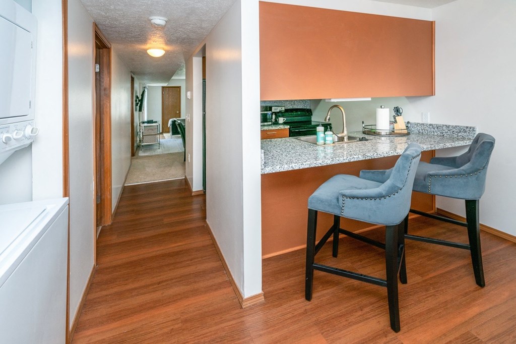 Fitted Kitchen With Island Dining at Raleigh House Apartments, MRD Apartments, East Lansing, Michigan