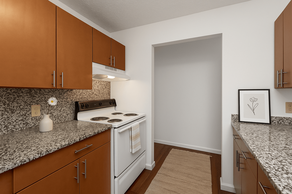 A kitchen with a white stove and brown cabinets.