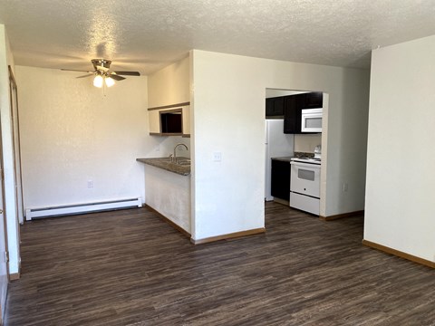 A kitchen area with a counter and a fan.
