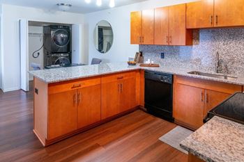 a kitchen with wooden cabinets and a counter top
