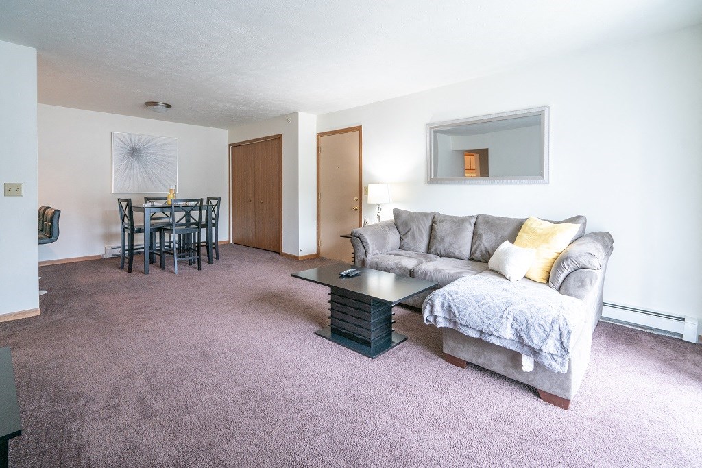 a living room with a couch and a table