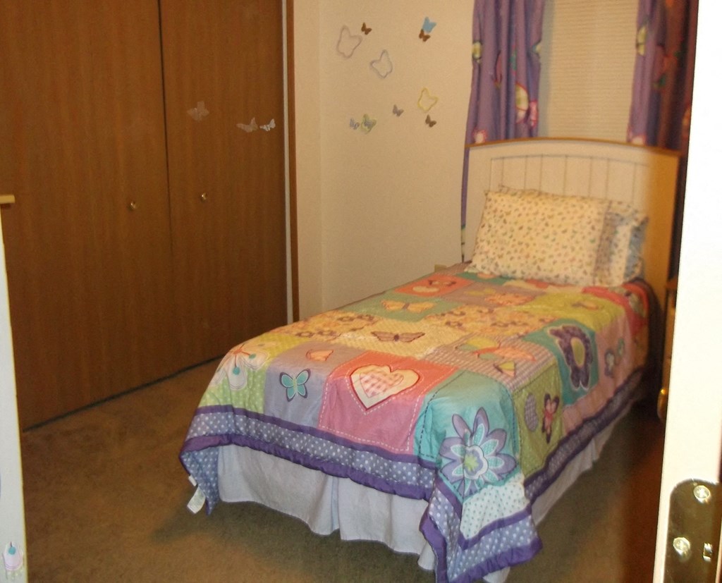 Bedroom With Closet  at Geary Estates Apartments, MRD Conventional, Grandview Plaza, KS