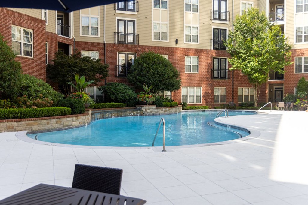 a swimming pool is shown in front of a fence