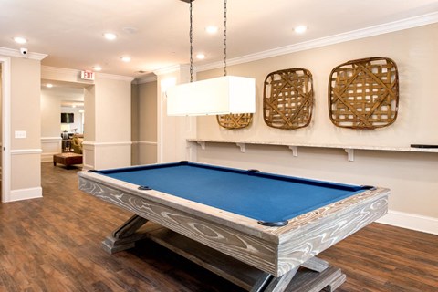 a billiards table in a game room of a home