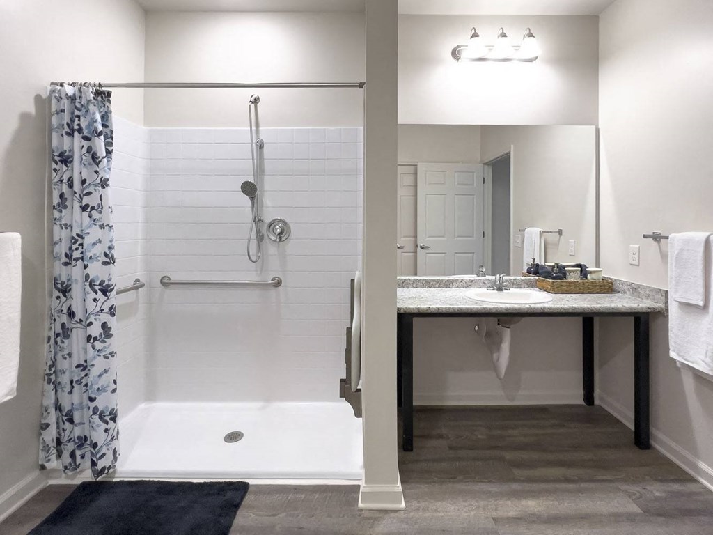 a bathroom with a shower and a sink