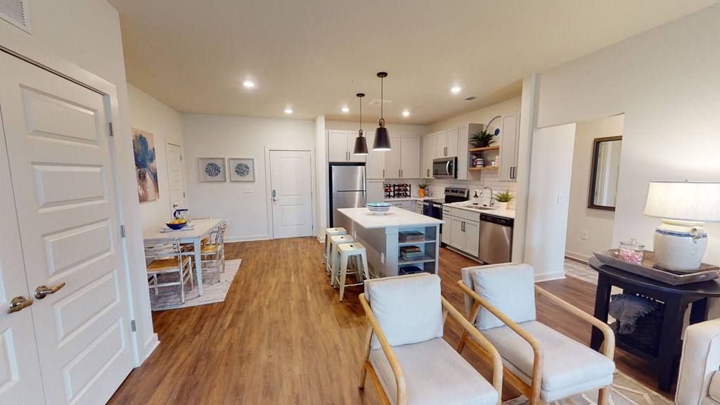 a kitchen and dining area in a 555 waverly unit at Walton Fayetteville, Fayetteville, GA