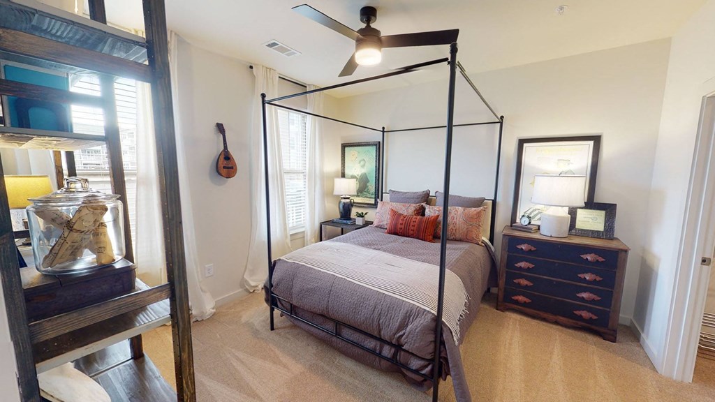 a bedroom with a bed and a dresser at Walton Fayetteville, Fayetteville, 30214