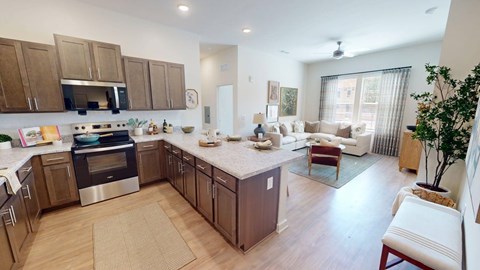 A kitchen with a stove top oven and a refrigerator.