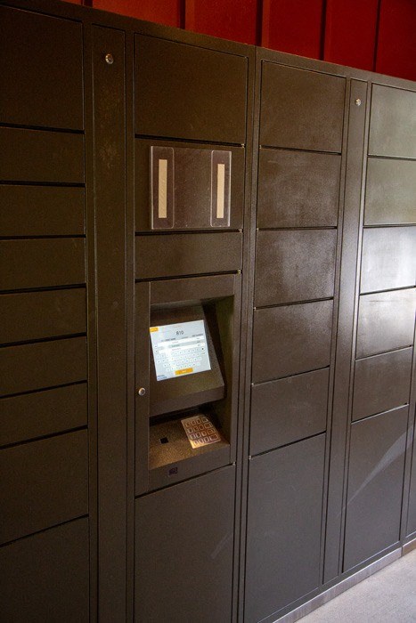 a row of lockers with a safe in the middle