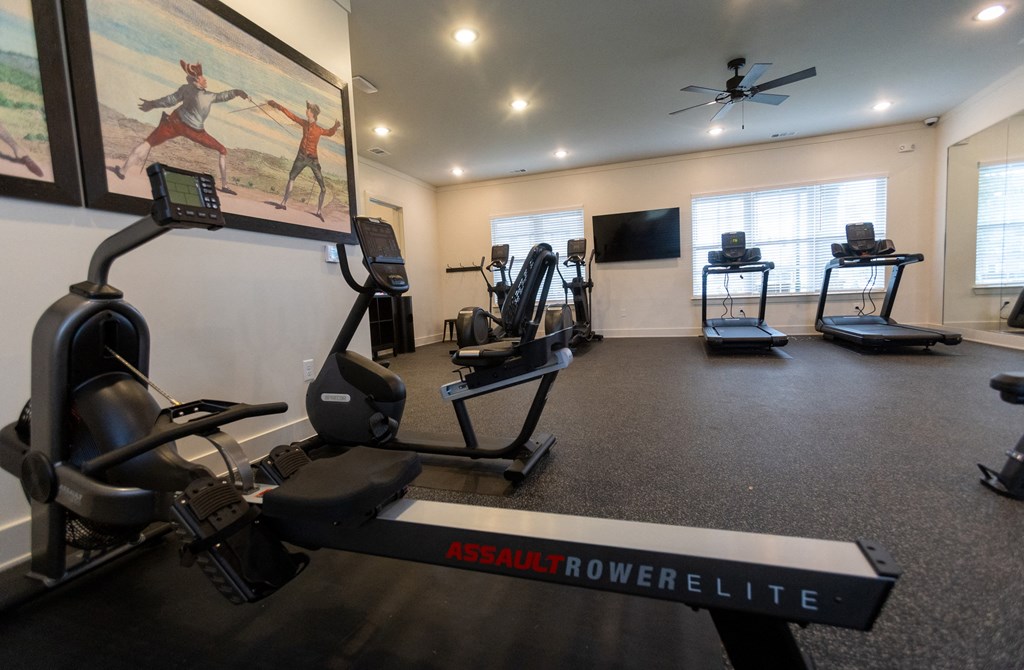 Walton Green family affordable community in Augusta, GA a gym with cardio equipment and a large screen tv