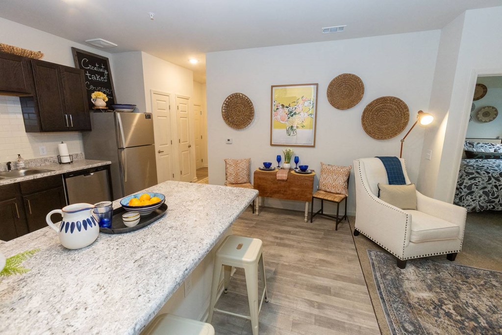 Walton Green family affordable community in Augusta, GA a kitchen and living room with a marble counter top