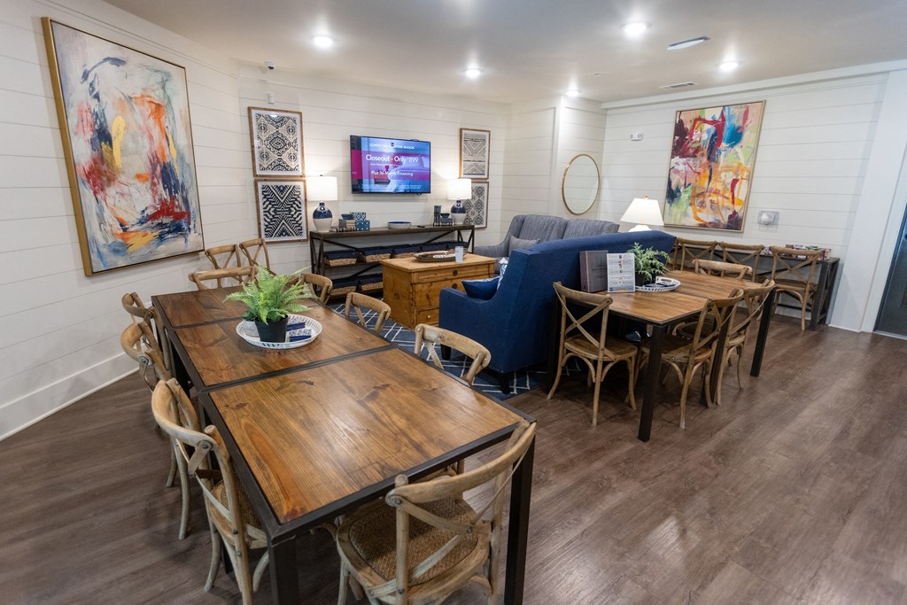 a living room filled with furniture and a flat screen tv
