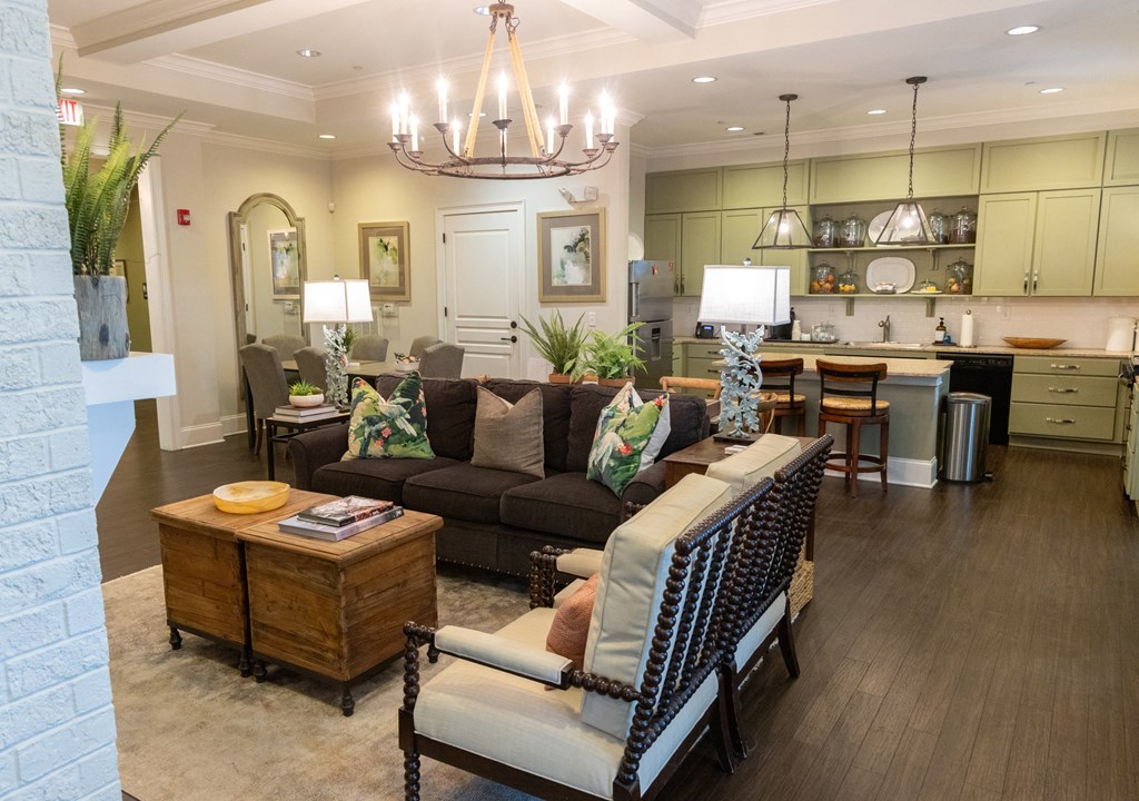 a living room filled with furniture and a chandelier