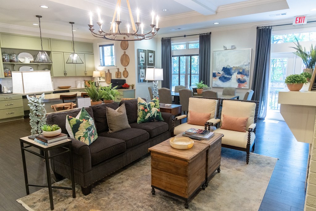 a living room filled with furniture and a large window