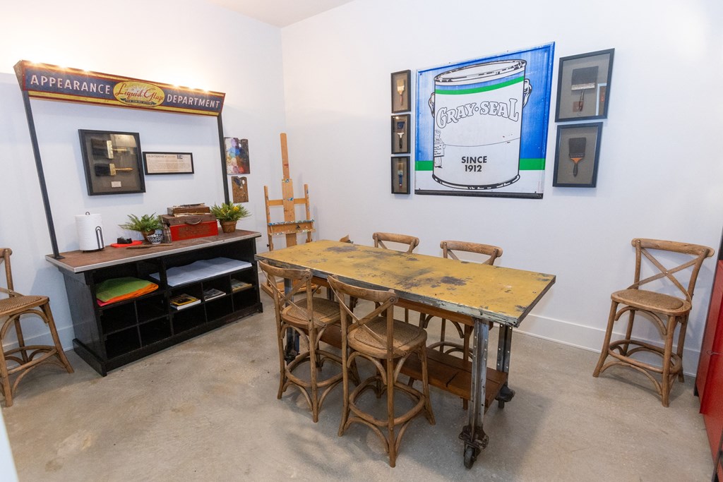 a dining room with a table and chairs