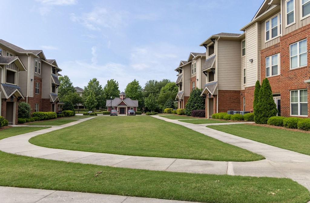 a large grassy area with a gazebo in the distance