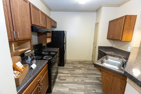 a kitchen with a stove and a sink