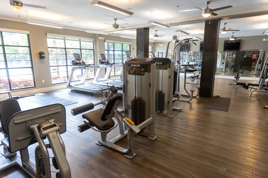 a room filled with lots of different types of exercise equipment