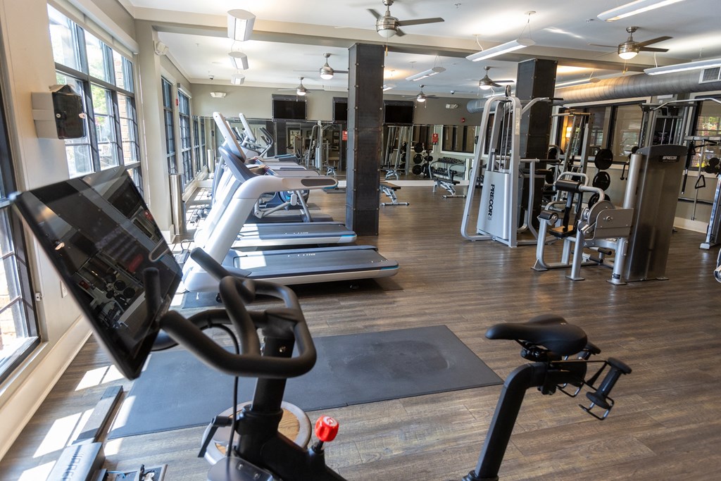 a room filled with lots of different types of exercise equipment