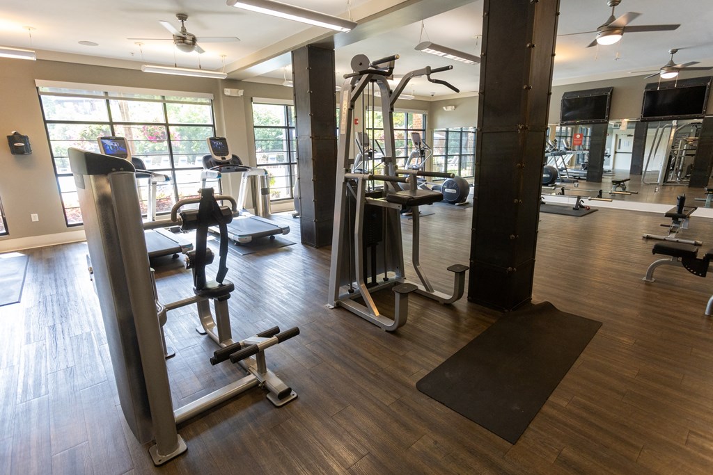 a gym with a lot of exercise equipment