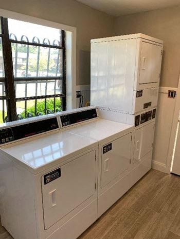 A laundry room with a washer and dryer  Brookwood at Islip, New York, 11751