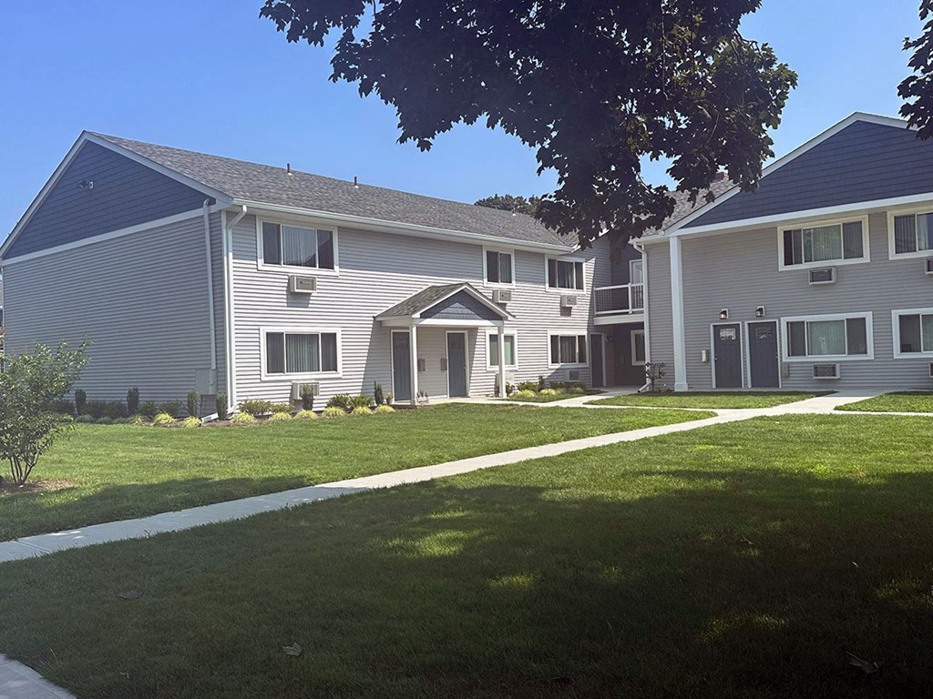 a view of the exterior of a building on a sunny day at Brookwood at Sayville, Sayville, New York
