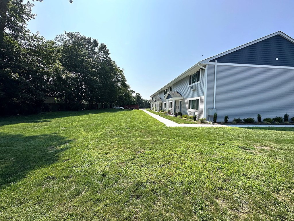 a large lawn in front of a house at Brookwood at Sayville, Sayville, NY