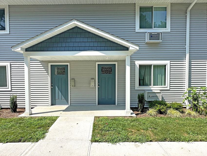 a house with two blue doors