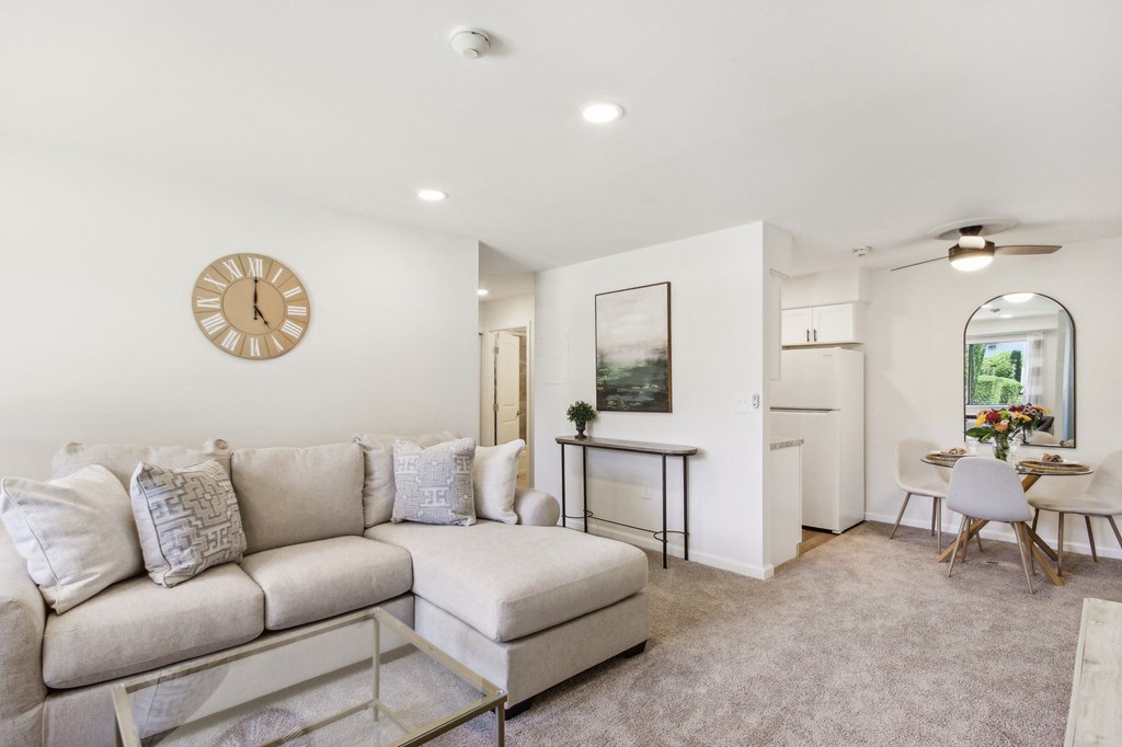 a living room with a couch and a coffee table at Brookwood at Ridge, New York, 11961