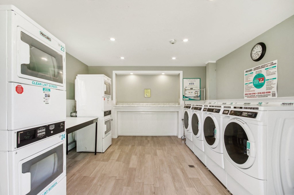 Laundry room facilities with Washers and Dryers at Brookwood at Ridge, New York, 11961