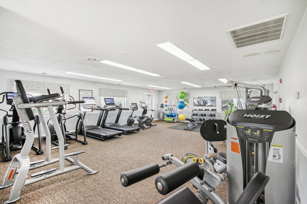 a view of our gym with various machines and weights at Brookwood at Ridge, New York, 11961