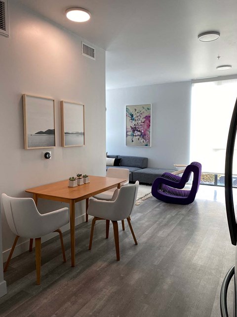 a dining room with a table and chairs