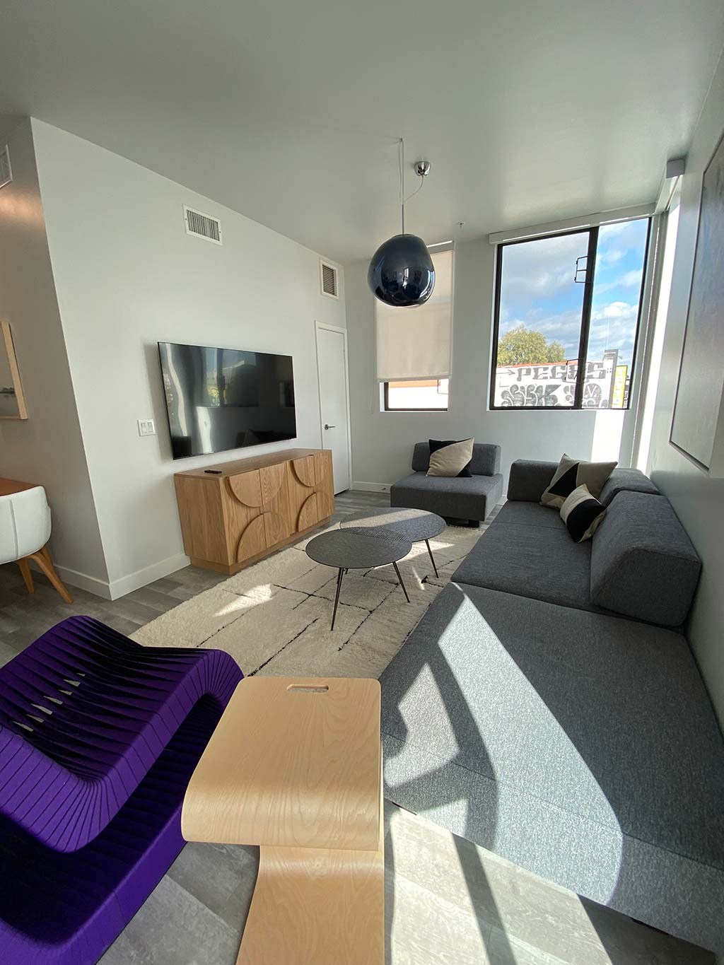 a living room with a couch and a tv