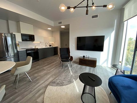 a living room and kitchen in a modern apartment