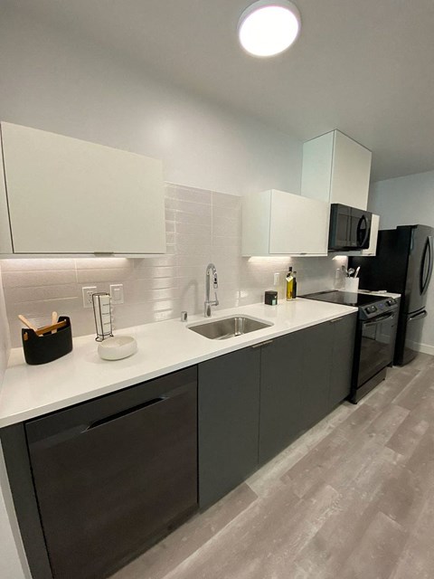 a kitchen with a sink and a counter top