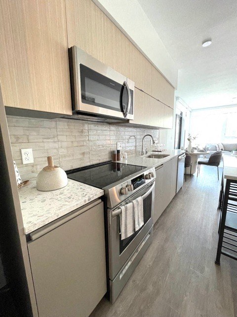 a kitchen with a stove and a microwave