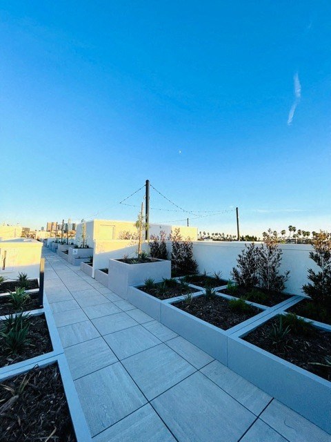 a view of the city from the rooftop garden of a building