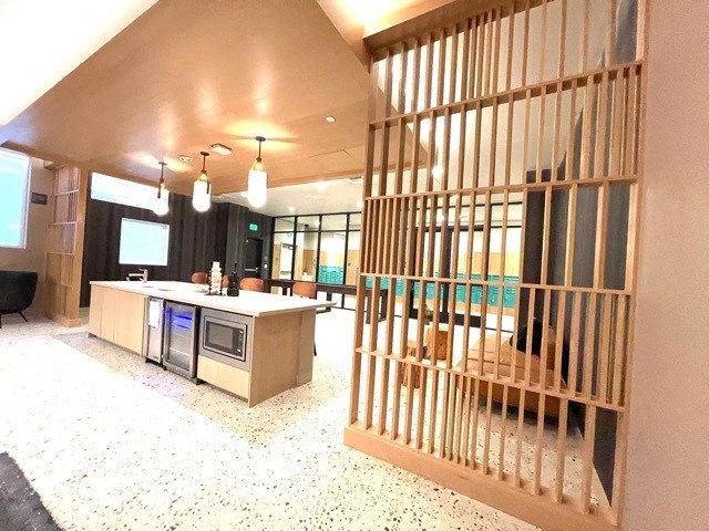 a view of the lobby of a building with a barred door