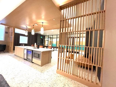 a view of the lobby of a building with a barred door