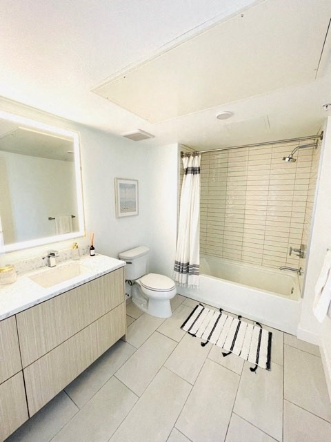 a bathroom with a toilet and a sink and a bath tub