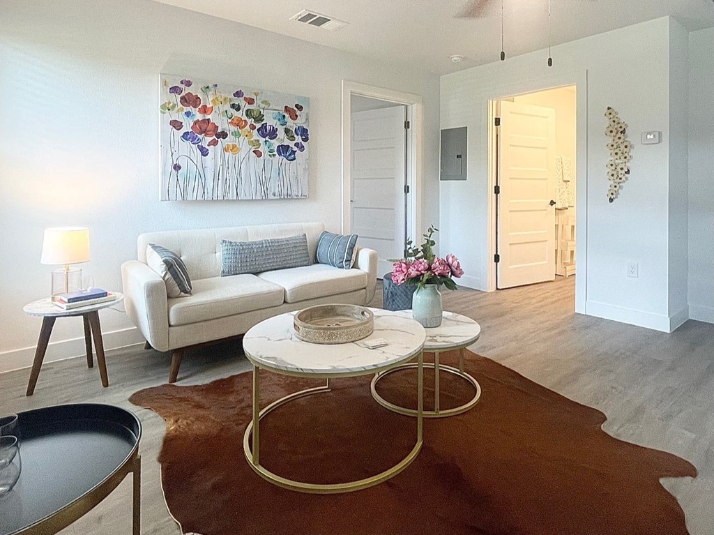 a living room with a white couch and a coffee table