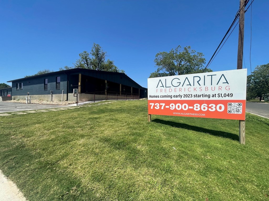 a sign in front of a building